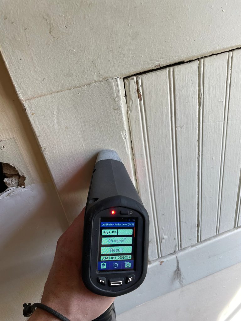 Lead paint testing in progress during a thorough home inspection before renovation.