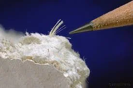 Microscopic view of asbestos fibers in vermiculite loose fill insulation sample