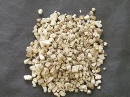 Raw vermiculite loose fill insulation granules used in older attic spaces