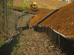 Silt fence installation demonstrating how to prevent soil erosion on a construction site