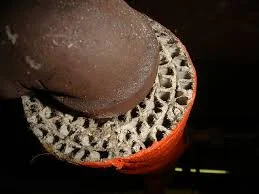 Close-up of asbestos pipe insulation similar to asbestos insulation in attic