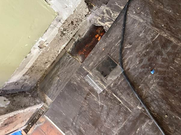 Asbestos floor tile sample raising concerns about how long do asbestos fibers remain in the air