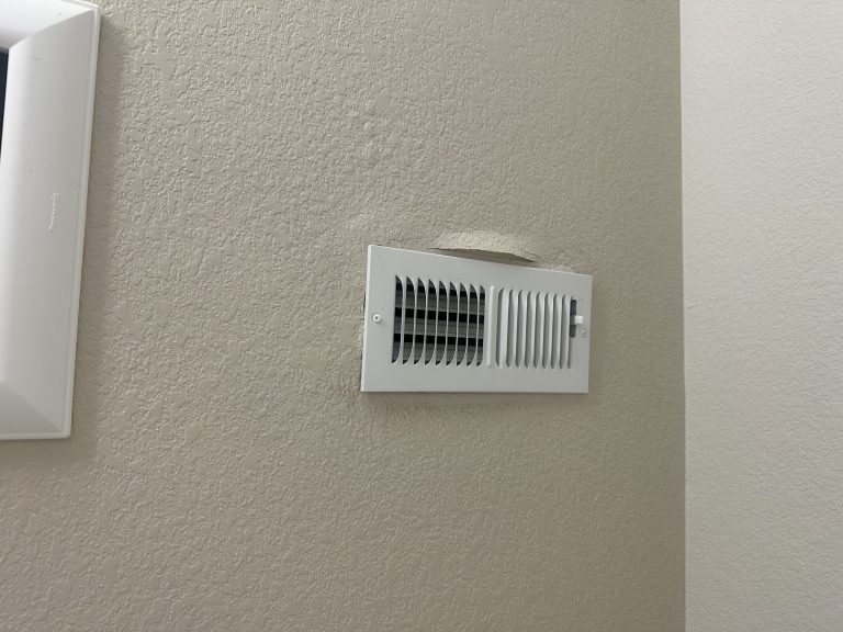 Ceiling vent showing possible buildup and risk of black mold in air vents