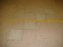 Old vinyl floor tiles that may contain asbestos portraying when to test for asbestos