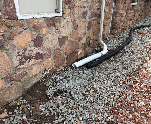 Downspout drainage issue that can cause toxic black mold
