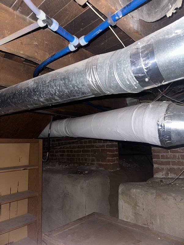 Wrapped insulation on basement pipes— sign of when to test for asbestos in older homes