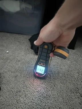 Moisture meter reading carpet levels during inspection to determine how long does mold remediation take.