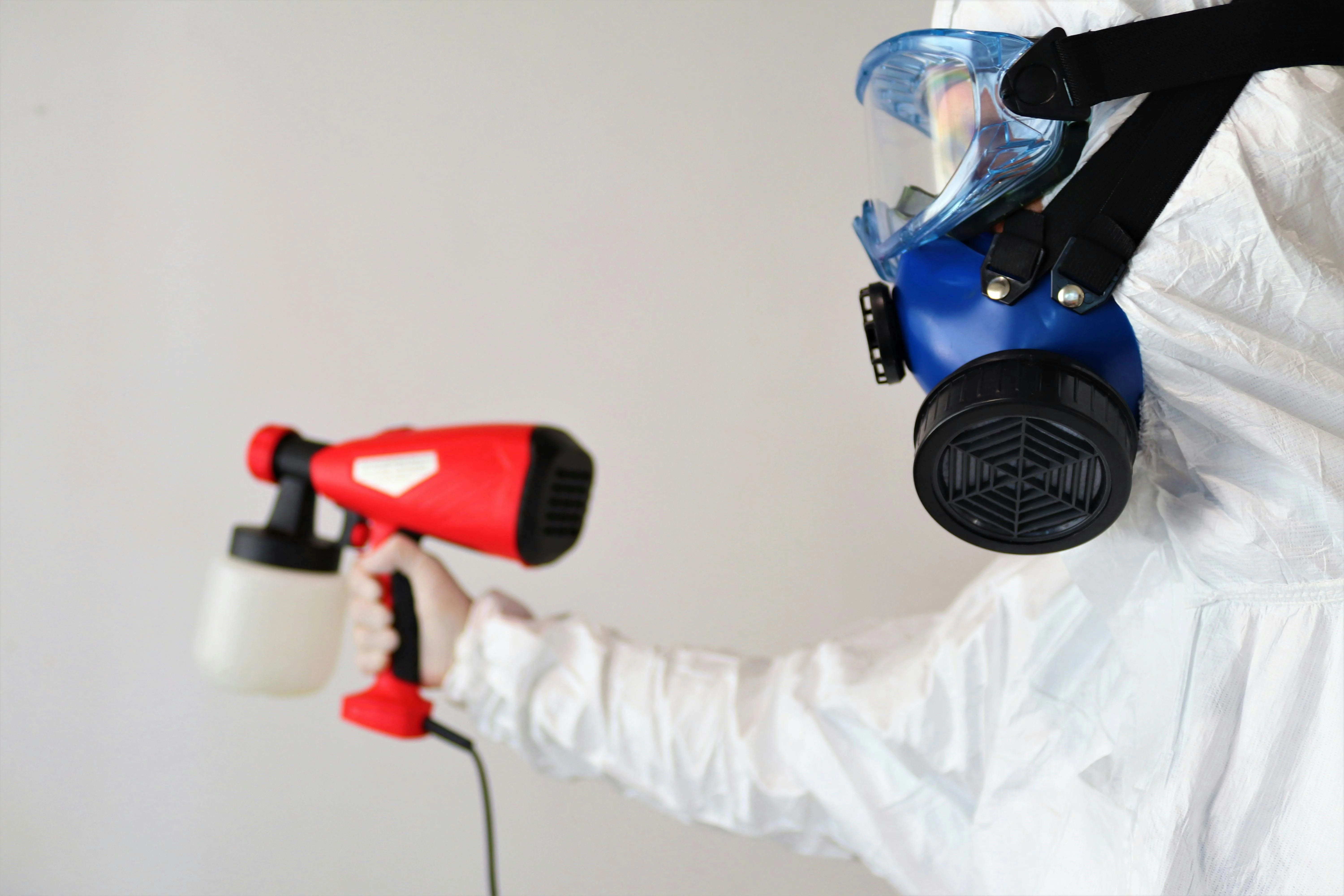 Protective equipment highlights mold abatement vs remediation during chemical mold treatment