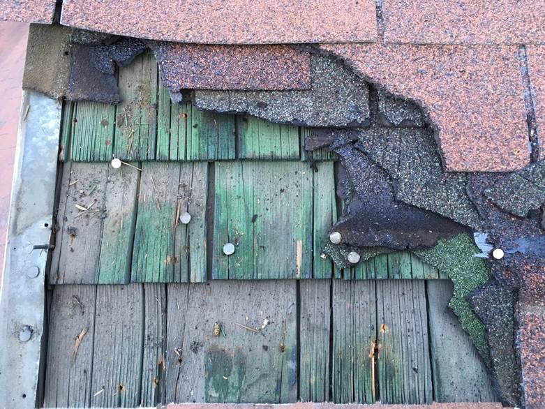 Damaged roofing materials connected to how to identify asbestos in insulation beneath old shingles